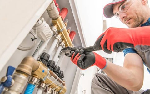 Gas Safe engineer from Blue8 Gas Services installing a new Worcester boiler in an Essex home